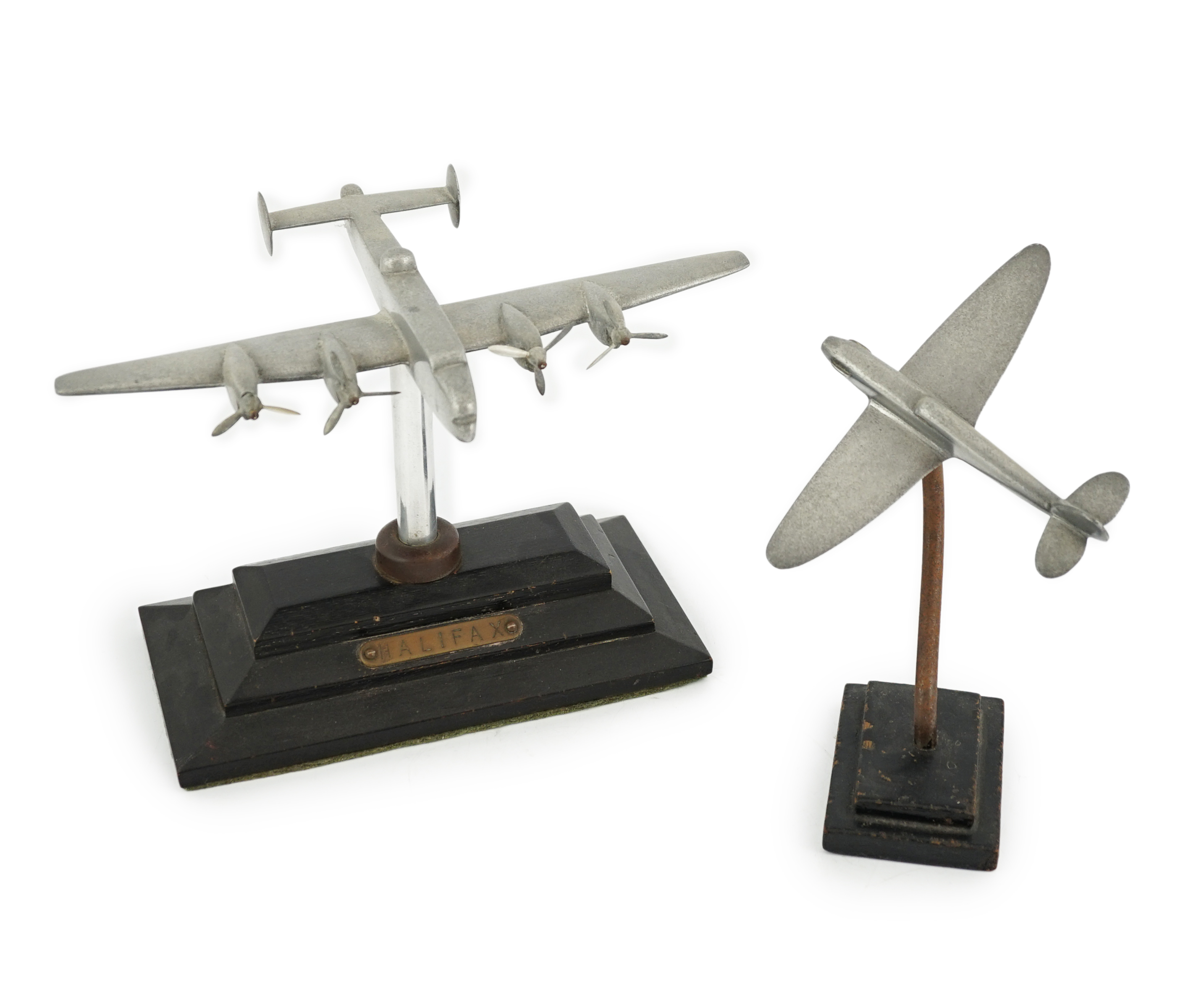 Two cast aluminium military aircraft models mounted on stepped wooden bases; a Halifax bomber, wingspan 30.5cm, and a Hawker Hurricane, wingspan 18cm